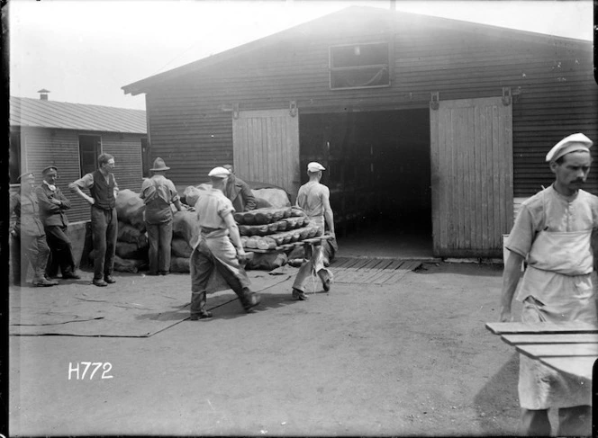 Carrying freshly baked loaves at the New Zealand Field Bakery, Rouen