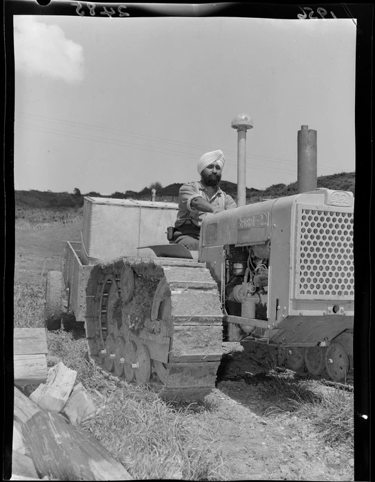 Unidentified Sikh man, driving a Bristol Track tractor, Whanganui