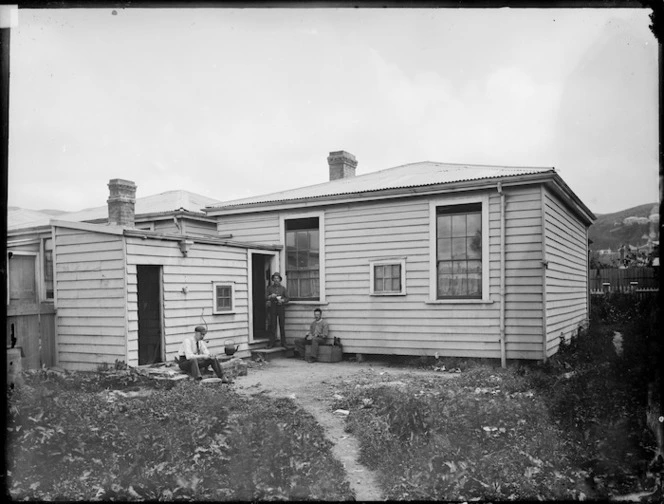 Cottage in Clayton's Avenue, Wellington, and men alongside
