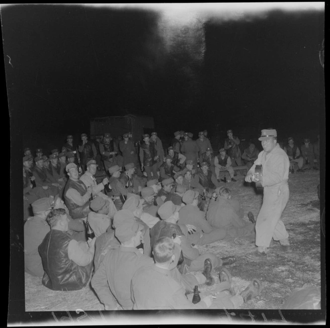 Soldiers for Malaya, gathered with guitar player