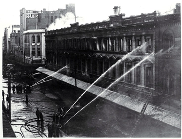 Image: Firemen dampening down Ballantyne's building, Christchurch