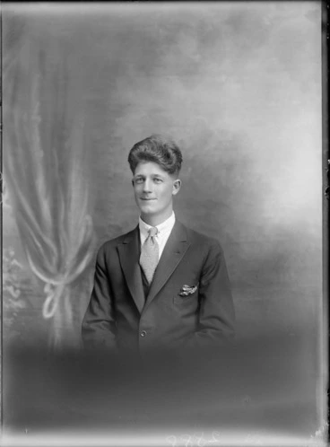 Image: Studio upper torso portrait of unidentified man in suit and tie with lapel pocket handkerchief, with bouffant hairstyle, Christchurch