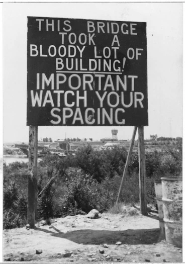 Image: Sign by a bridge over the Po River, Italy, during World War 2