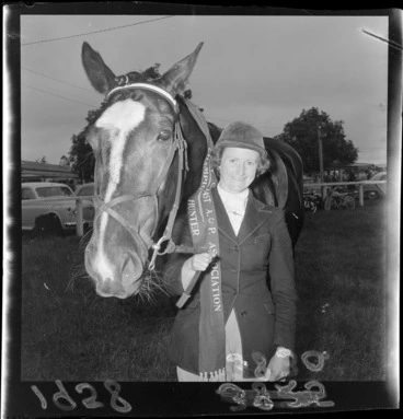 Image: Unidentified female equestrian with her horse, winners of champion hunter award at the Palmerston North Agricultural & Pastoral Show (A & P Show), Manawatu-Whanganui Region