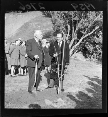 Image: Walter Nash and an unidentified man planting a tree on Arbour Day, location unidentified