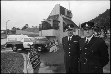 Image: Two unidentified traffic officers near road signs to be used on the Wellington Motorway