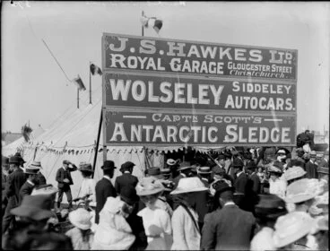 Image: JS Hawkes Ltd Royal Garage exhibition tent at A&P show, Christchurch, with signage advertising Wolseley Siddley autocars, and Captain Scott's Antarctic sledge