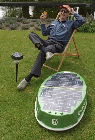 Image: George Ryan and a solar-powered lawnmower - Photograph taken by Ray Pigney