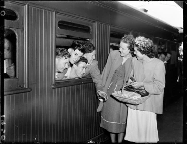 Image: Women talking to soldiers on a train at Wellington Railway Station