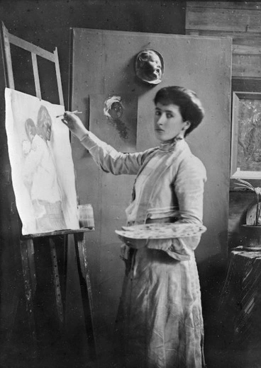 Image: Portrait of Frances Mary Hodgkins painting at an easel in her studio in Bowen Street