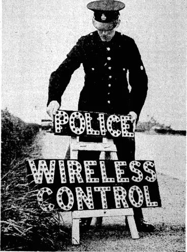 Image: Radio control boxes are being erected between Preston and" Blackpool, in the north of England.' It is expected that by this means traffic officers ivill be able to prevent congestion on one of the very busiest roads in England. A traffic officer is seen placing A warning sign in position near his control box. (Evening Post, 30 July 1938)