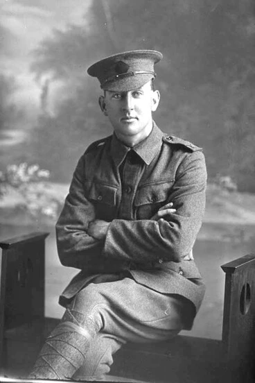 Image: Full portrait of Rifleman Claude Roy Ayling seated. Reg No. 23/59, of the New Zealand Rifle Brigade.
