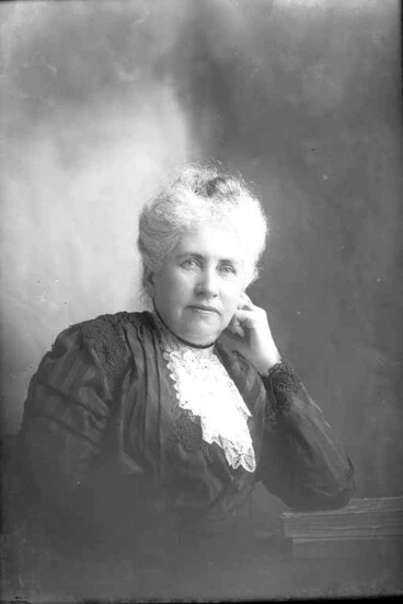 Image: 1/4 portrait of Mrs Hewlett leaning her left elbow on books and....