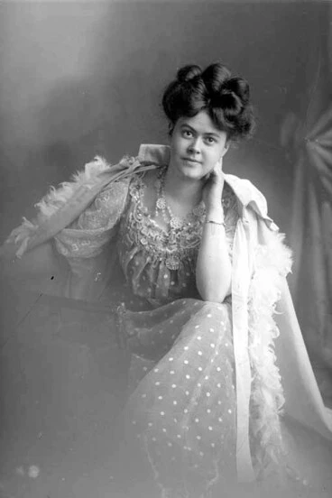 Image: 3/4 portrait of Miss Brookfield, leaning her left elbow on her....