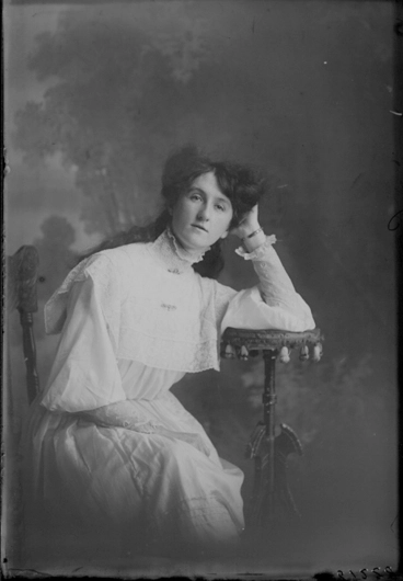 Image: 3/4 length portrait of Miss Kearney, sitting resting her elbow....