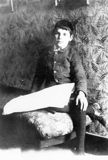 Image: Boy sitting on a chair