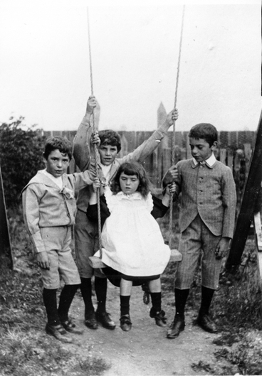 Image: Four children by a swing