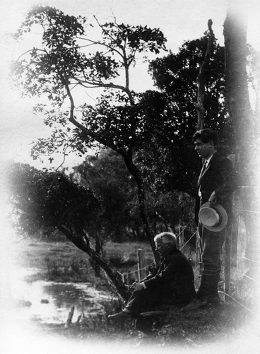 Image: Charles Haigh and an older man on a river bank