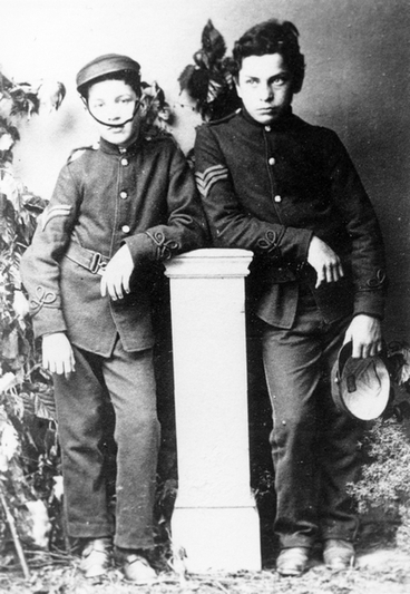 Image: Two boys dressed in military costume