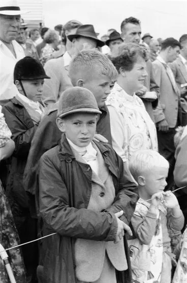 Image: Boy in equestrian outfit amongst the crowd at Kumeu A & P show