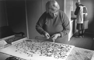 Image: Hidden Lives: the work of care. Audrey doing a jigsaw puzzle.