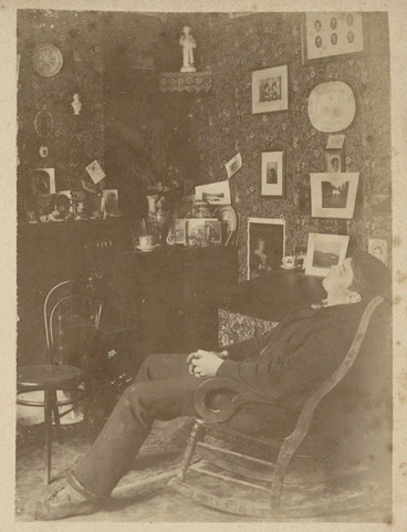 Image: Room interior with young man in a rocking chair