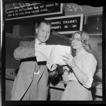 Image: Patrick O'Hagan, Irish singer, with an unidentified woman, at the taxation office, Wellington