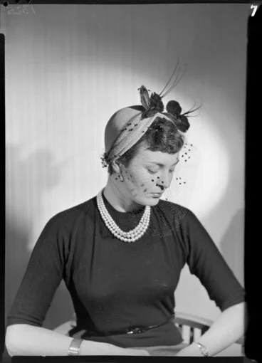 Image: Woman modelling hat with veil