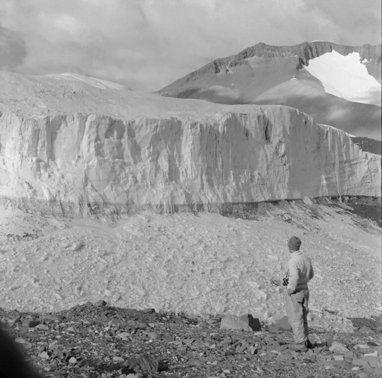 Image: Geologist, Peter Webb, views the terminal face of the Upper Victoria Glacier