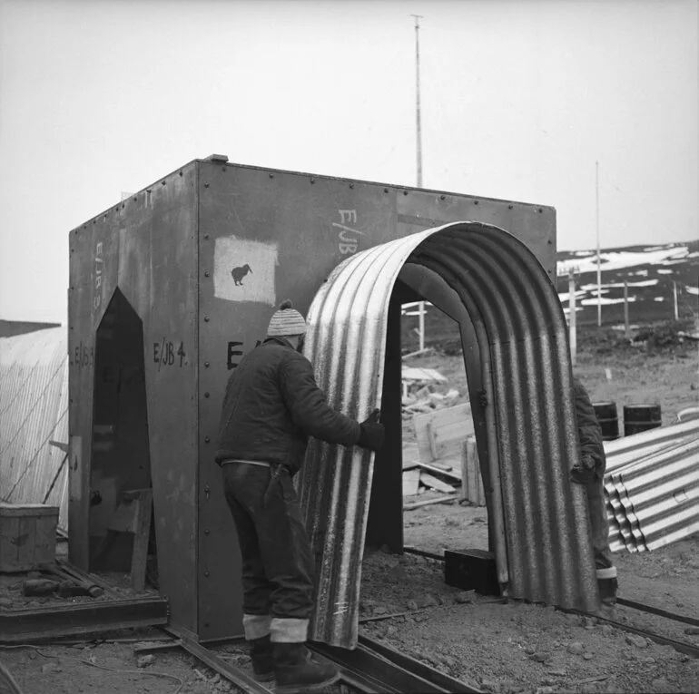 Image: The corrugated iron covered way, used to connect separate buildings, being erected