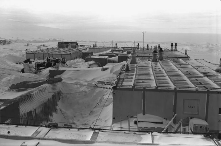 Image: View of Scott Base showing the snow accumulation after winter, 1958