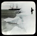 Image: [Man standing on ice, ship in background]