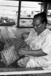 Image: Kiliti completing small kete 'coconut frond basket'.