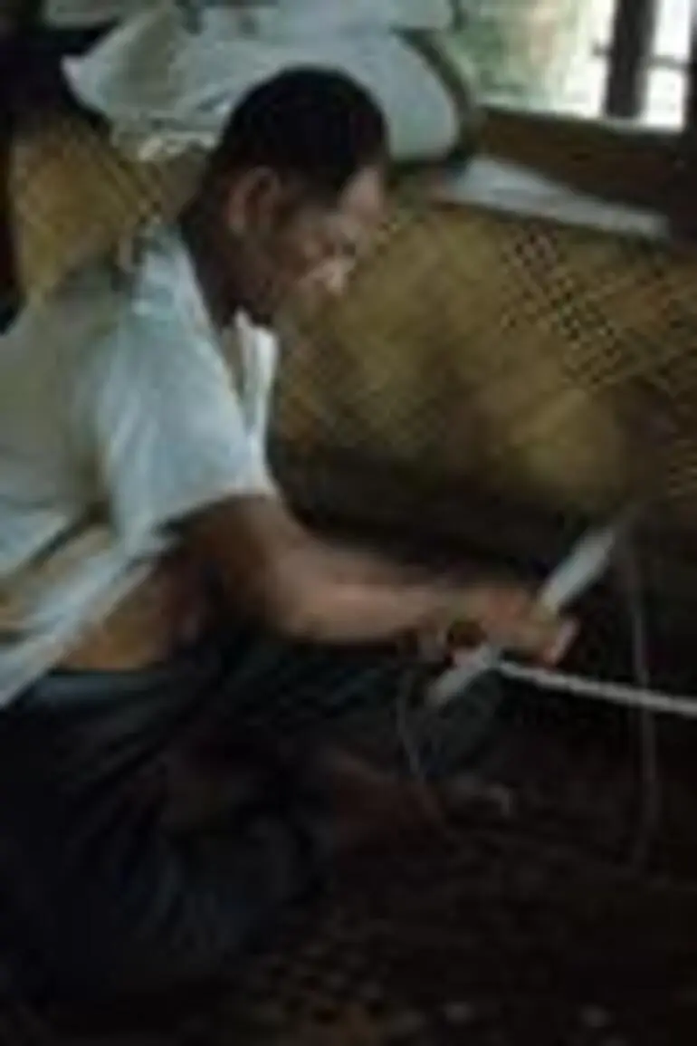 Image: Toeaina all together making village fishing net