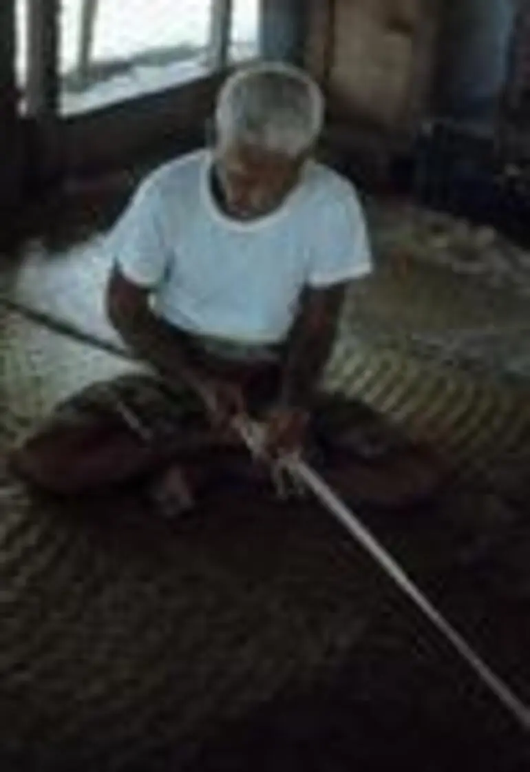 Image: Toeaina all together making village fishing net