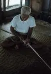 Image: Toeaina all together making village fishing net