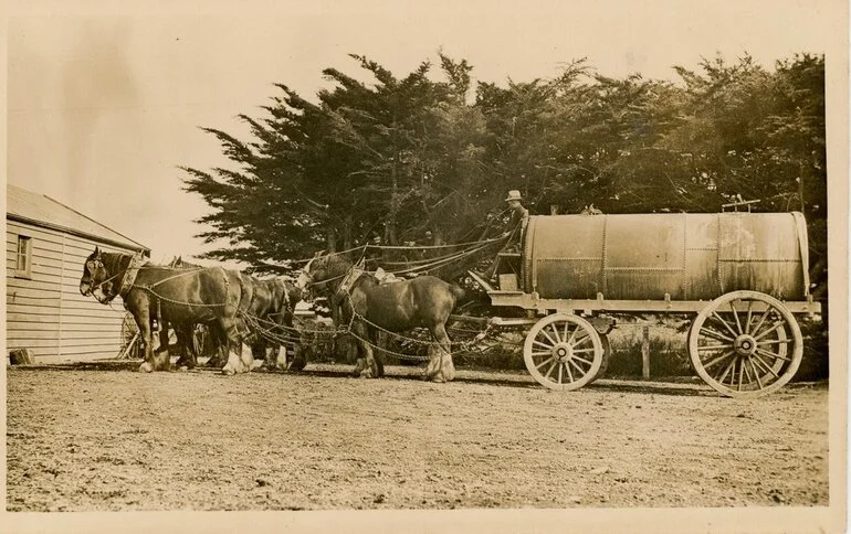 Image: Horse team pulling a wagon with large cyclinder atop