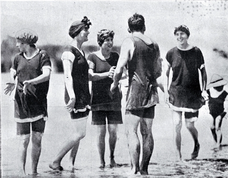 Image: A group of young bathers in bathing costumes in the surf at Sumner beach on the Anniversary Day of Christchurch