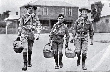 Image: Cheerful boy scouts acting as messengers to distribute food and medicine to patients at their houses during the influenza epidemic