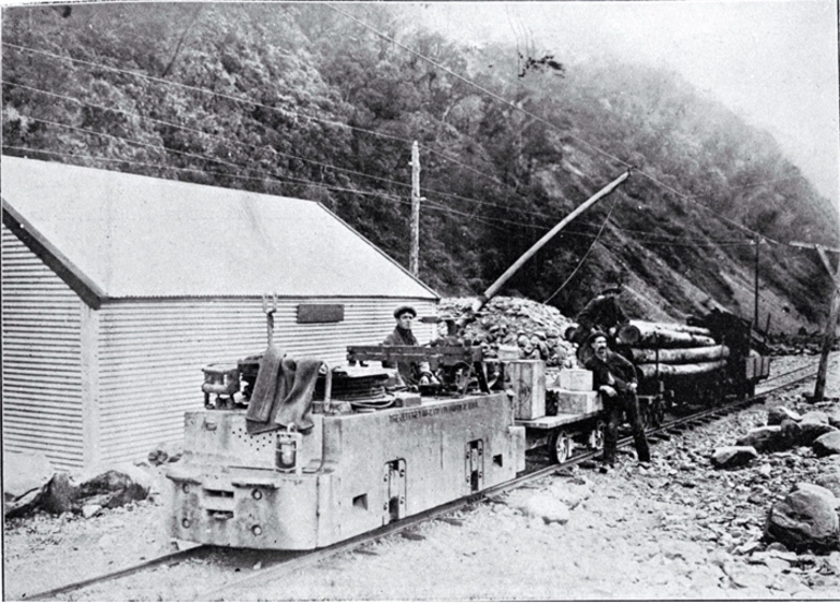 Image: Electric locomotion with a train load of explosives and timber to be used in the construction of the Arthur's Pass Tunnel