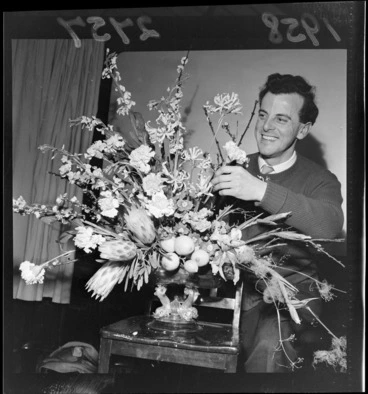 Image: Maurice August demonstrating the art of floral arrangement