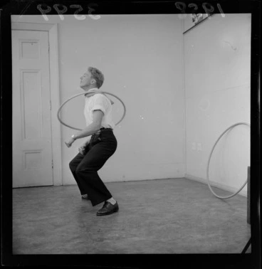 Image: Mr C Matthews, demonstrating a Hula hoop, unknown location