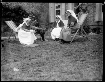 Image: Matron Price at a garden party in the grounds of the New Zealand Stationary Hospital, France