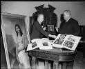 Image: Portrait of  Rex Nan Kivell (left) handing over his collection of early Australian items to Senator the Hon. Sir Alistair [i.e. Alister] McMullin, President of the Senate, at a ceremony at Australia House, 16 January 1959 [picture] /
