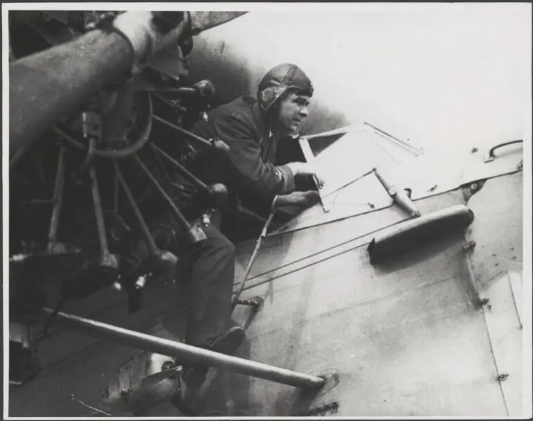 Image: Charles Ulm climbing out of the cockpit of Fokker F.VIIb/3m, VH-USU, Southern Cross, 1928 [picture].