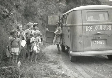 Image: School children alongside a Volkswagen Kombi school bus on a country road