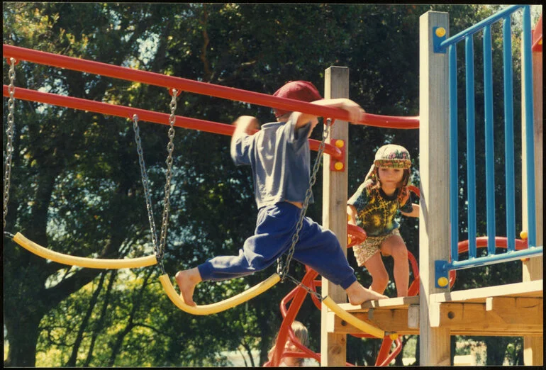 Image: Children on playground equipment. Jungle gym