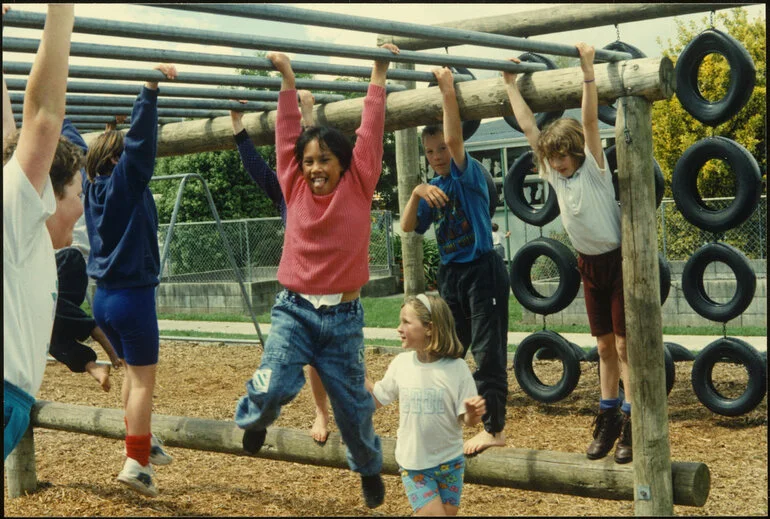 Image: Children on playground equipment. Jungle gym