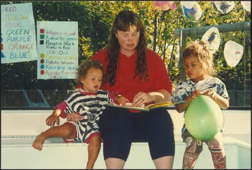 Image: Teacher reading with children
