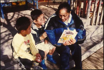 Image: Adult reading with children